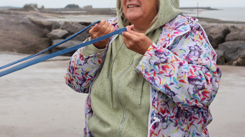 Woman holding a rope on the beach