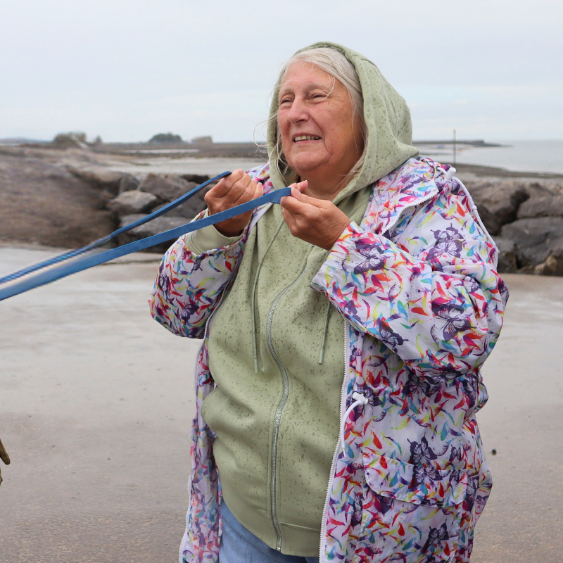 Woman holding a rope on the beach