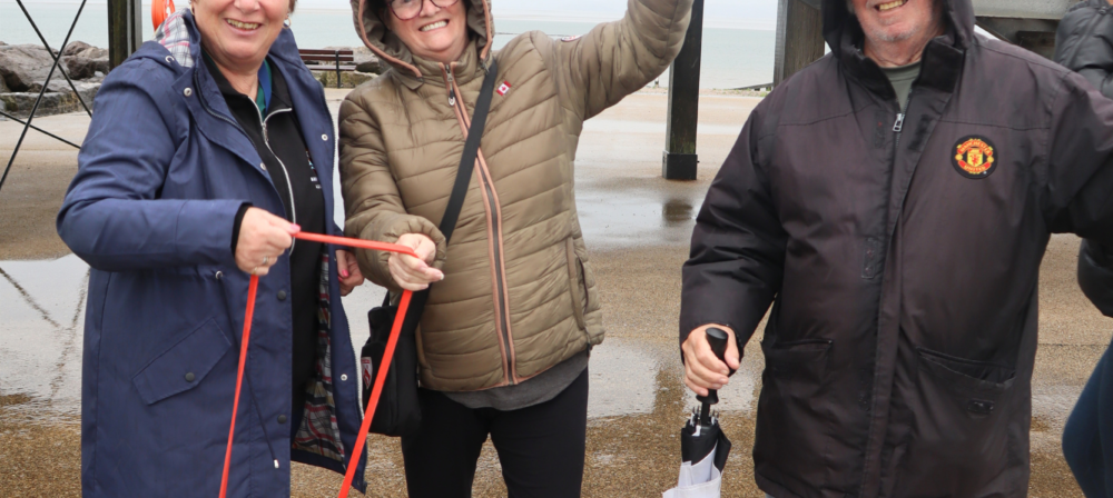 Three people posing with walking poles