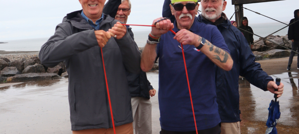 Three people standing with walking poles