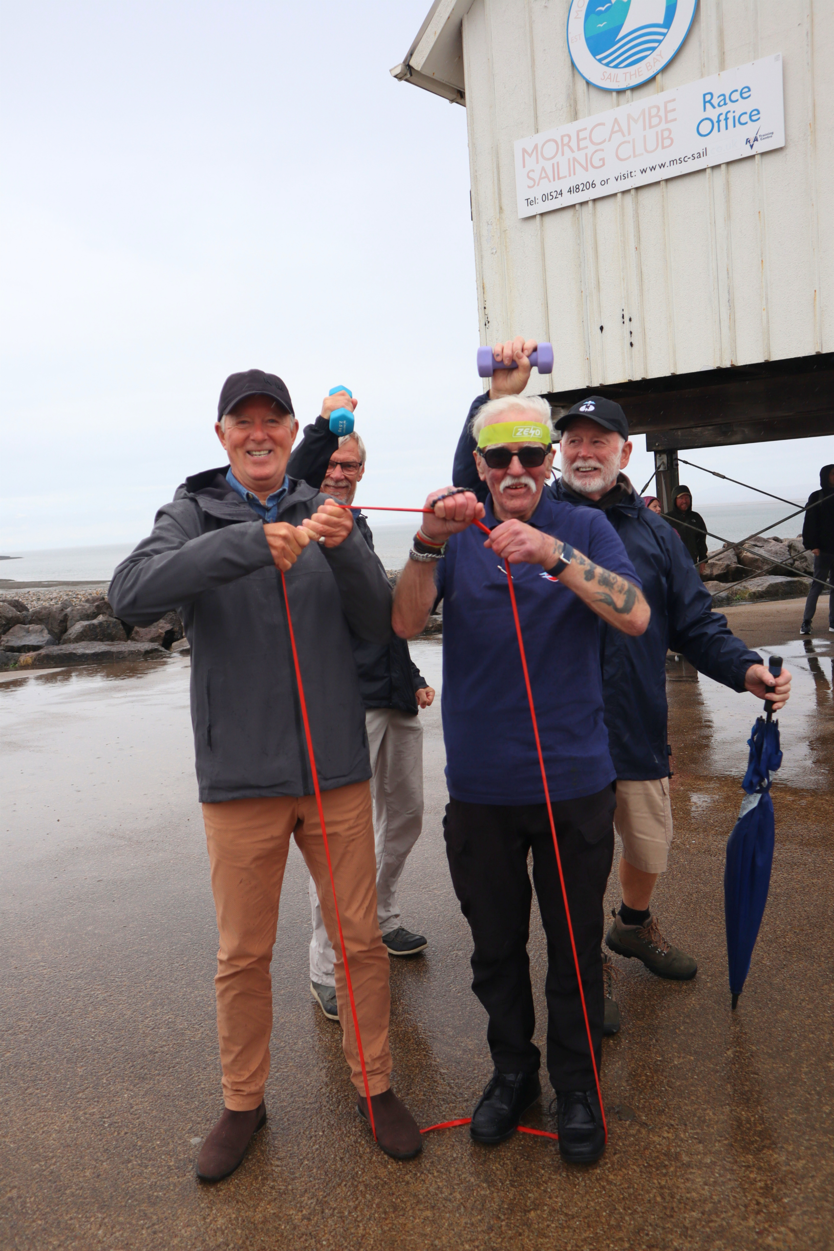 Three people standing with walking poles