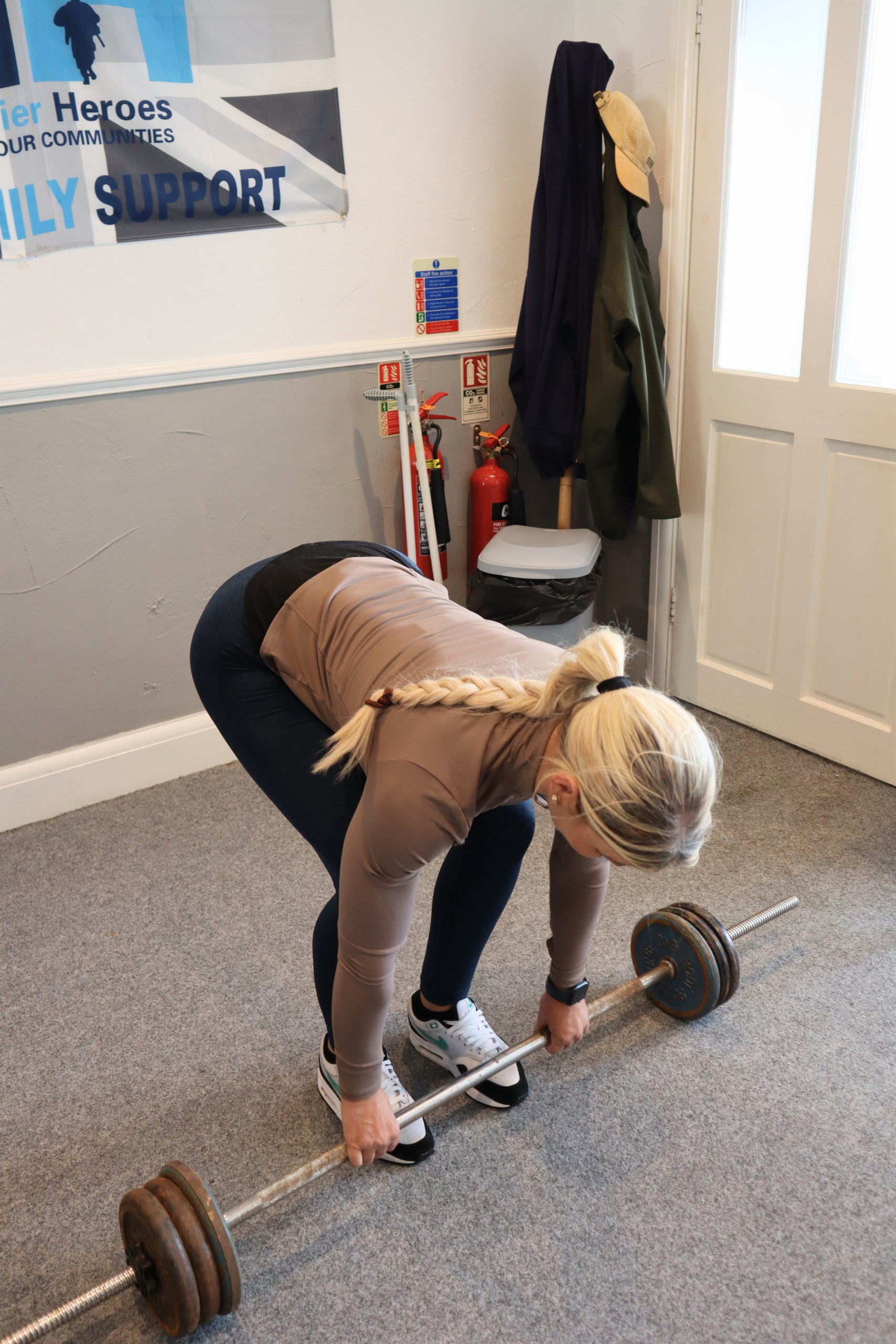 Woman preparing to lift a barbell
