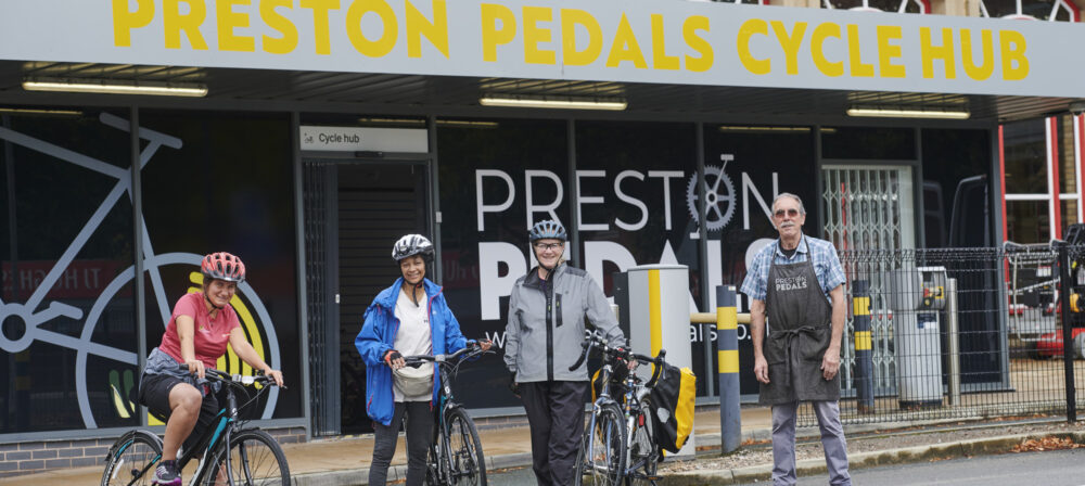Cyclists standing outside Preston Pedals at Preston Railway Station