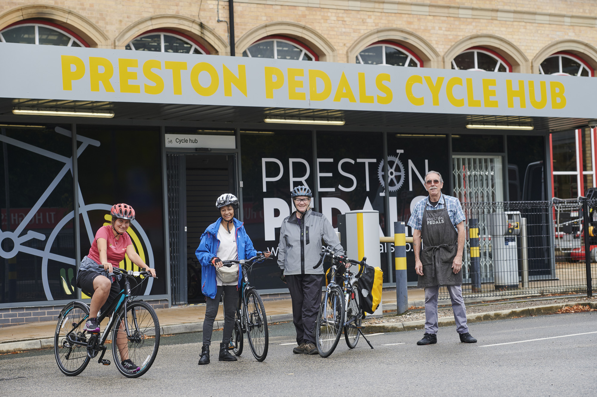 Cyclists standing outside Preston Pedals at Preston Railway Station