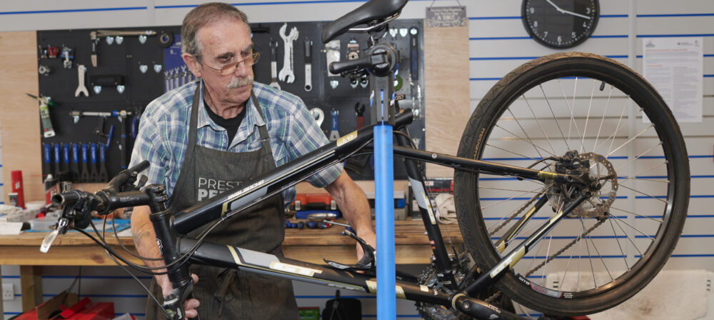 Man holding bike at Preston Pedals